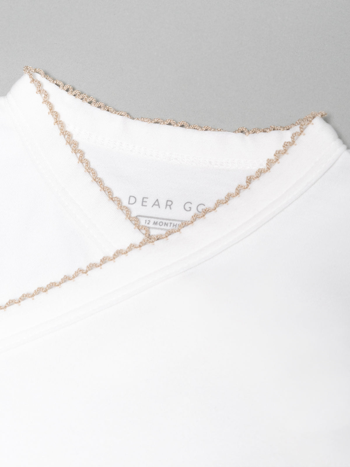 Signature Baby Bodysuit In Taupe Trims